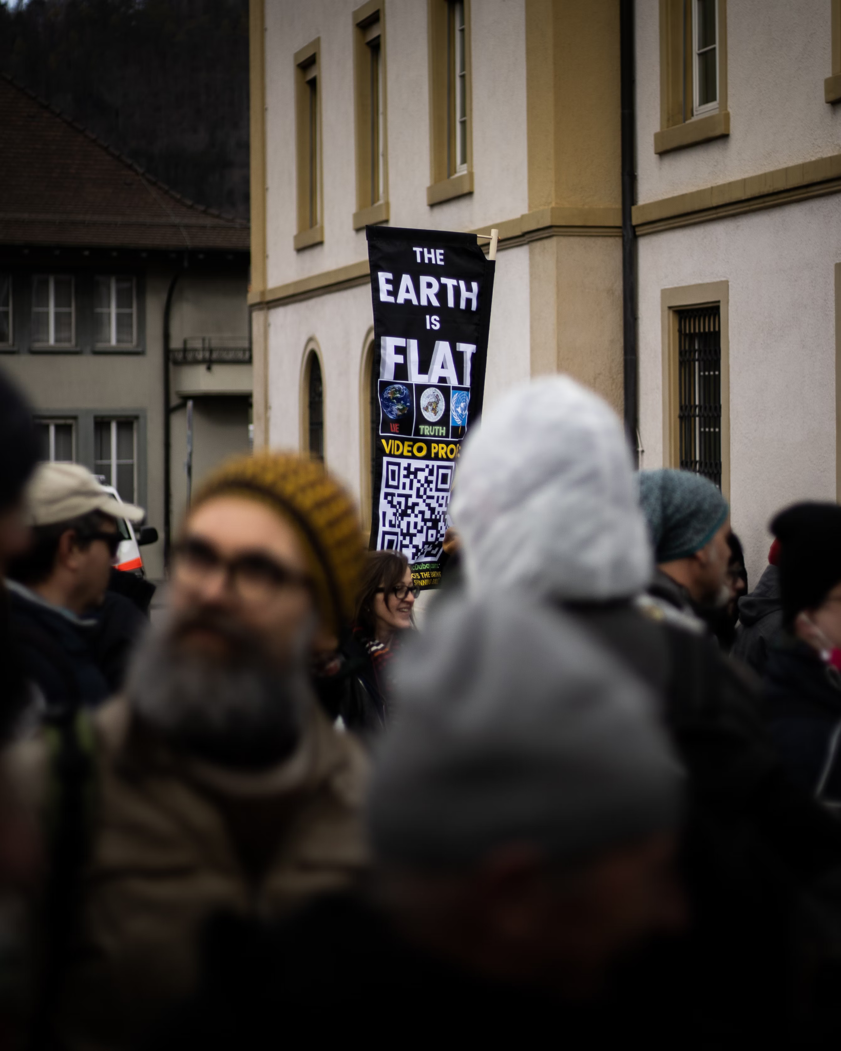 “The Earth Is Flat” sign at a 2021 protest against pandemic measures in Liestal, Switzerland.