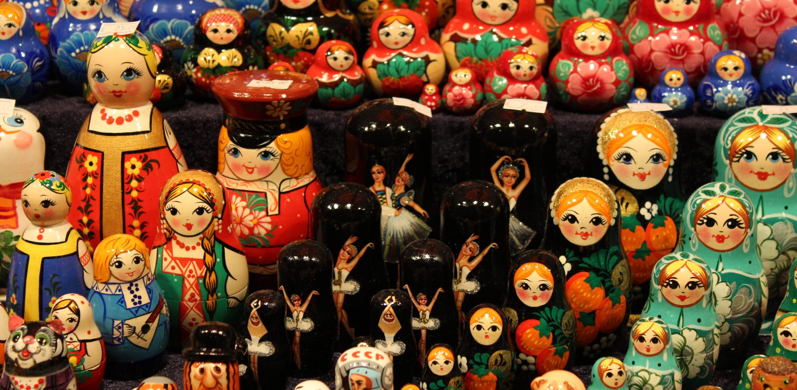 Rows of colorful Russian nesting dolls of different sizes.