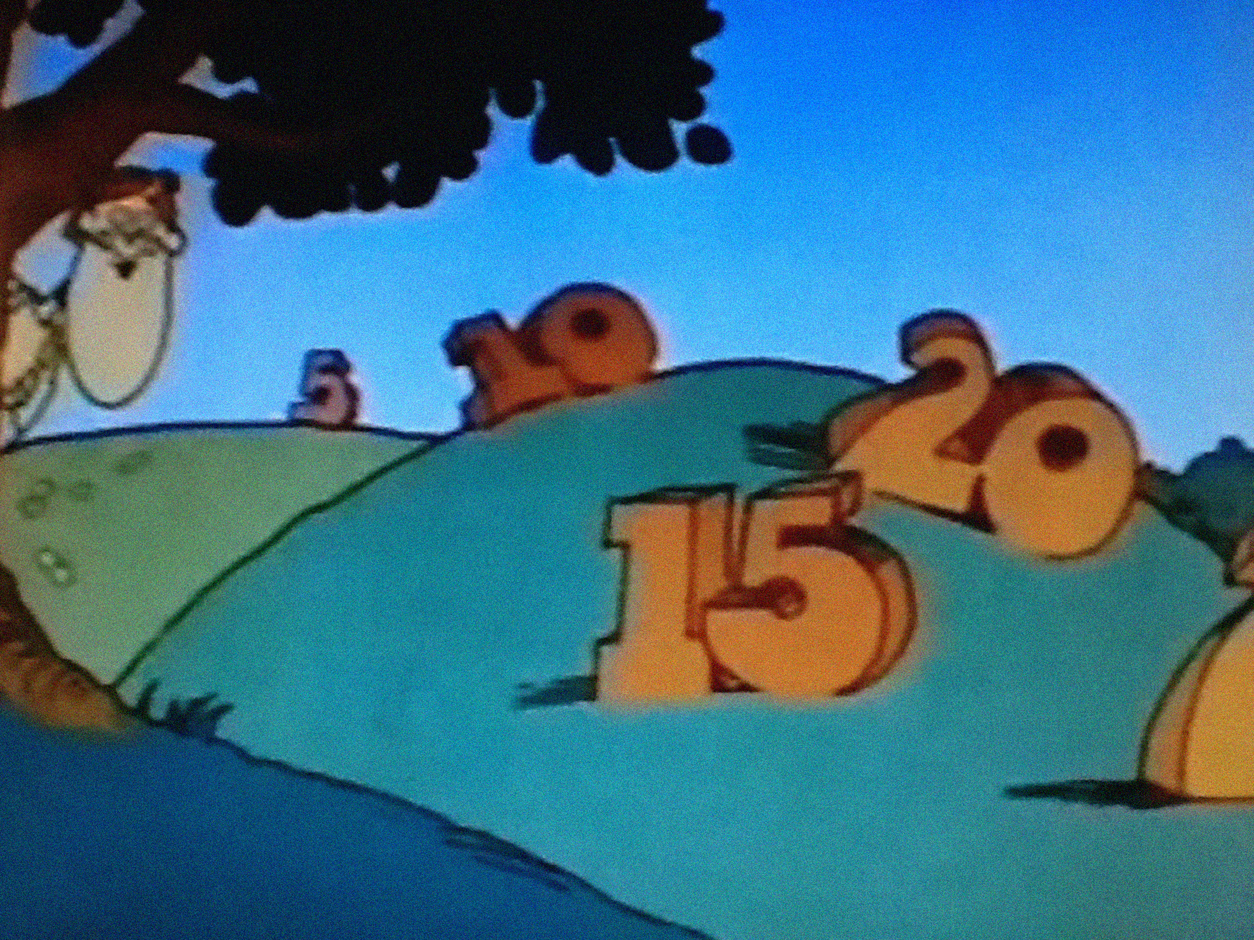 Still from an episode of Schoolhouse Rock! with numbers sitting on a hill.