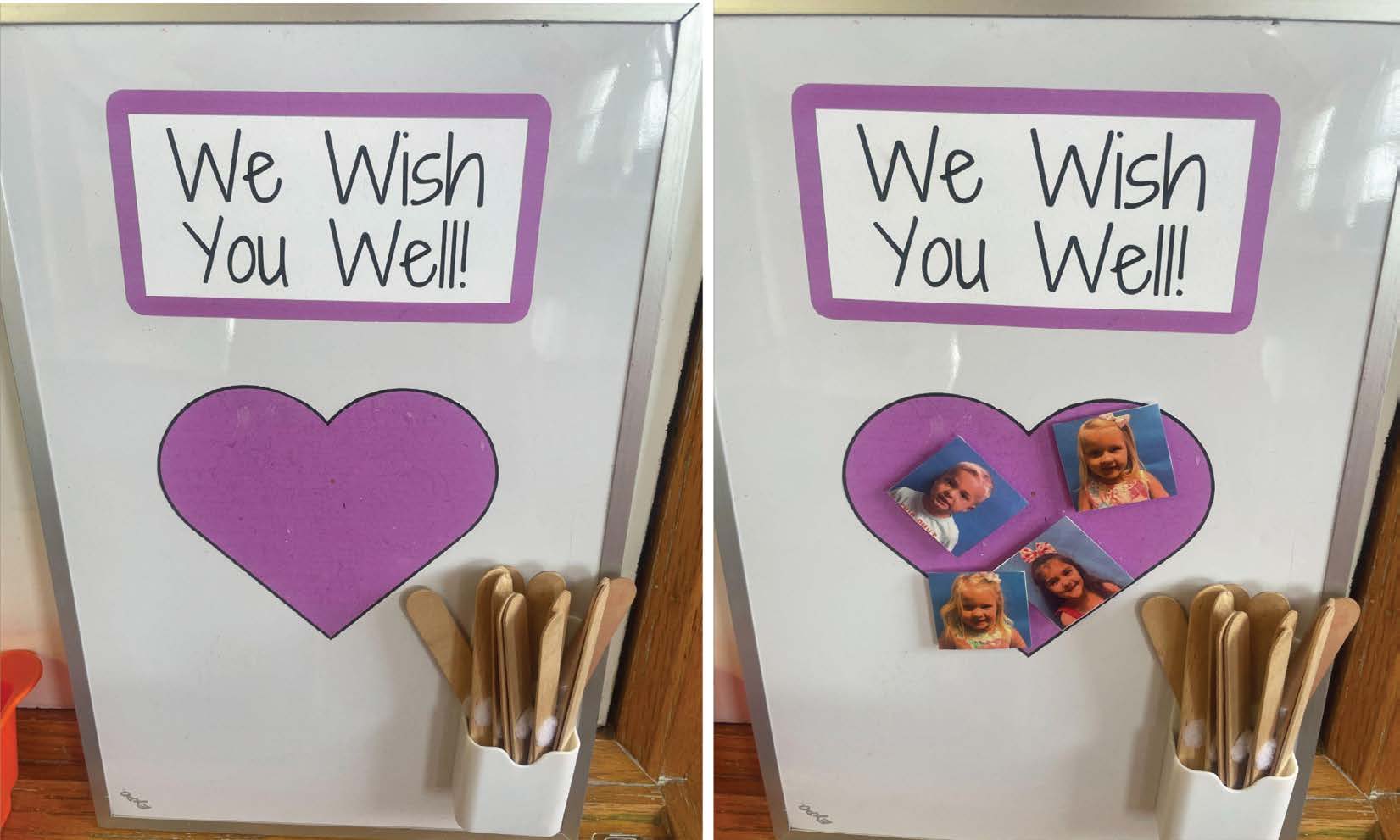 A whiteboard with the words We Wish You Well at the top, with a purple colored heart underneath. Four children's photos have been attached to the heart, showing which students are absent.