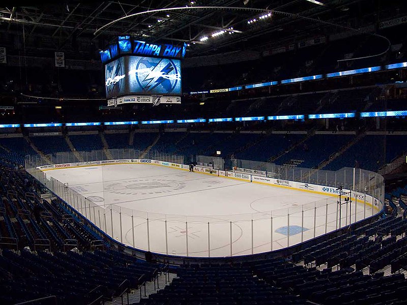 Inside view of the St. Pete Times Forum, now Amalie Arena, where the Tampa Bay Lightning Play. No crowd is present and a lightning bolt is displayed on the big screen in the center of the arena.