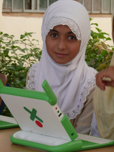 An image of a child in front of a laptop