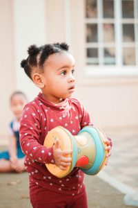 A child holding a toy