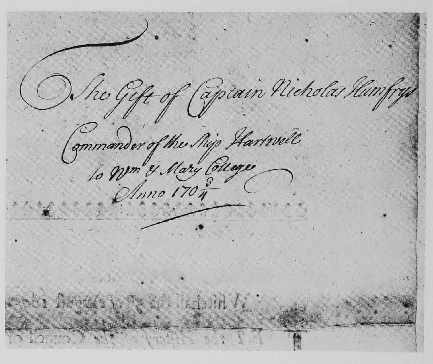 The inscription, in script, says "The Gift of Captain Nicholas Humfreys, Commander of the Ship Hartwell to Wm & Mary College, Anno 1703/4."