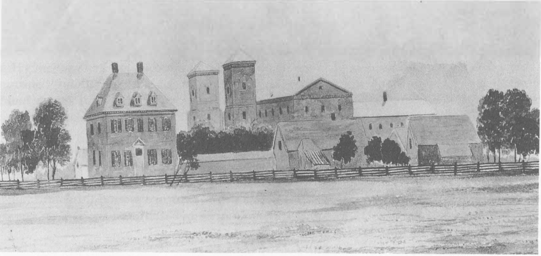 View from Richmond Road with the Presidents house on the left, several smaller buildings, and the main building in the background.