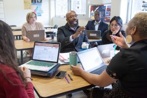 Seventh-grade social studies teachers gather for a meeting.