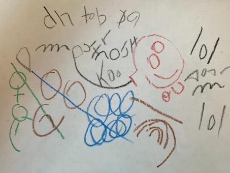 Child's writing has random capital letters across the top and a picture of a store and a mother underneath the letters.