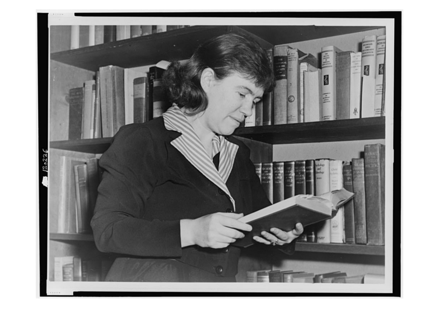 Portrait of Dr. Margaret Mead reading a book.