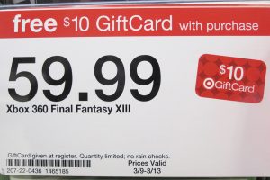 A photograph of a price tag from Target. Across the top, a red ribbon says “free $10 GiftCard with purchase.” The price is listed as 59.99 for Xbox 360 Final Fantasy XIII. On the right side of the label is a picture of a gift card, showing a Target logo with “$10 GiftCard.” Along the bottom is a barcode for the item and the serial number. The bottom also says “GiftCard given at register. Quantity limited: no rain checks. Prices valid 3/9-3/13.”